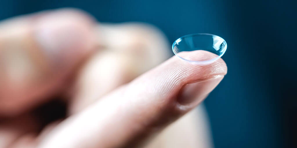 Close up of a contact lens on finger